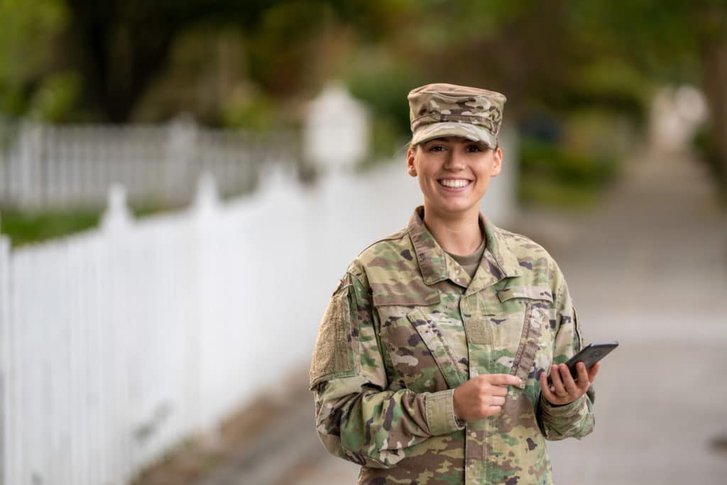 US Military woman using mobile phone