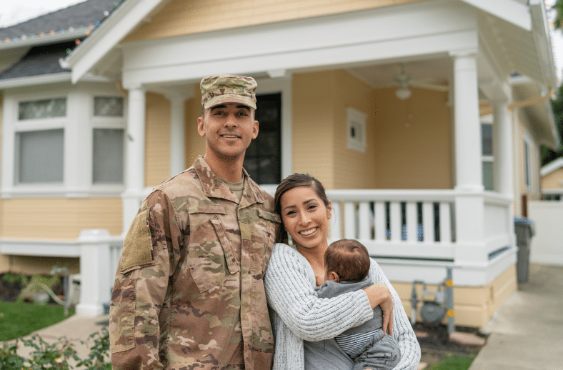 military family in front of a house