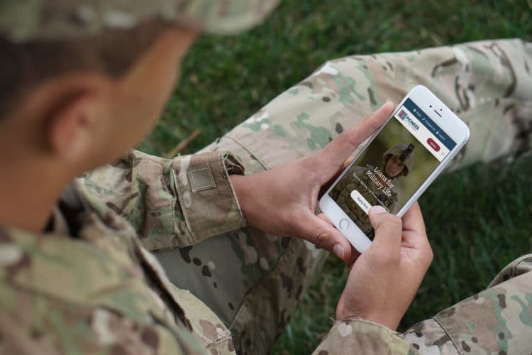 military man applying for military loans on his mobile phone